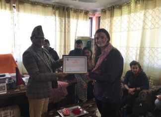 Appreciation certificate rewarded to volunteers by RM chairperson in Manahari, Makawanpur